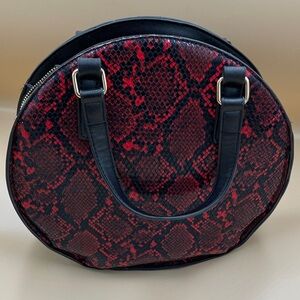 Kaari Blue Red and Black Snake-Print Mini Round Bag